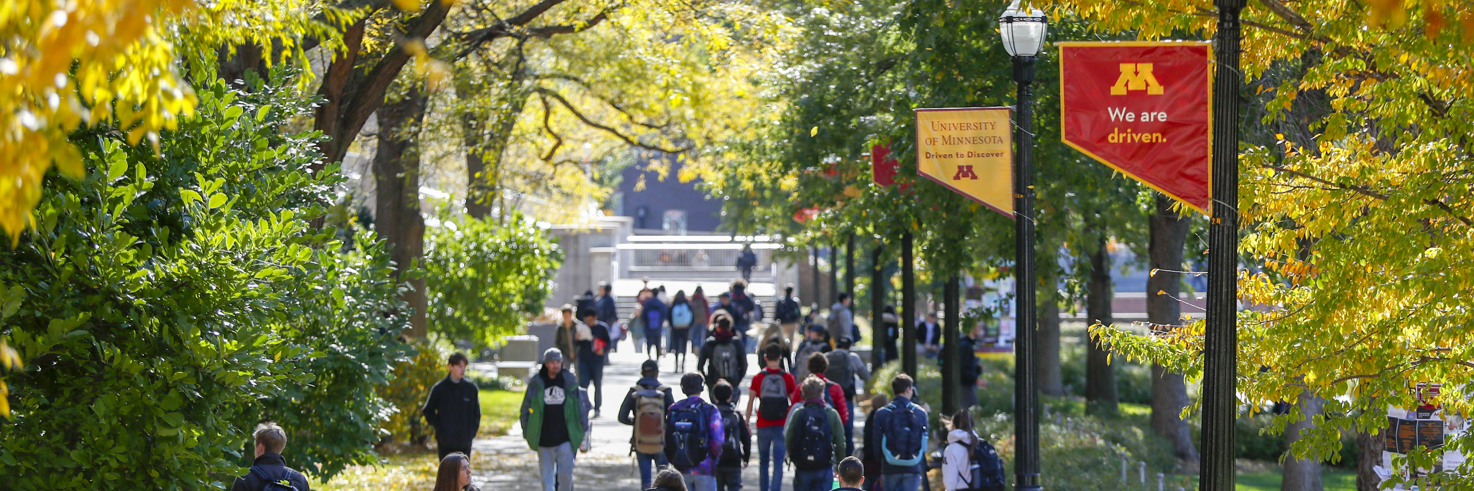 Image of students walking across campus.